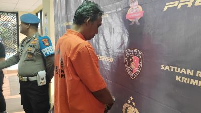 HJ (49), pelaku pecah kaca yang menggasak barang berharga milik pengemudi Toyota Fortuner Neneng (52).