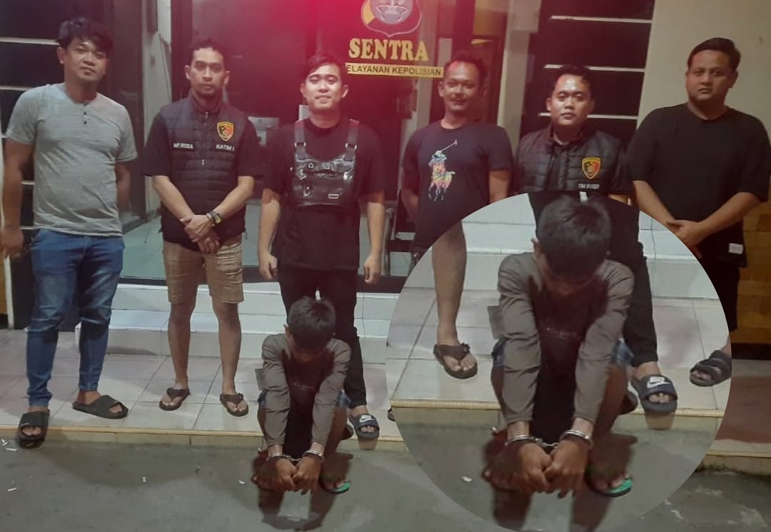 IK (28) saat dibawa ke Polsek Cikarang Timur karena diduga menganiaya dan mengancam seorang wanita. Foto: Ist