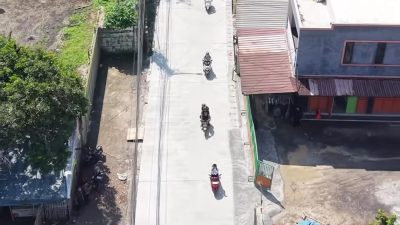 Kota Bekasi - Kondisi ruas Jalan Raya Caringin, Kota Bekasi, yang baru saja dilakukan perbaikan. Foto: Gobekasi.id.