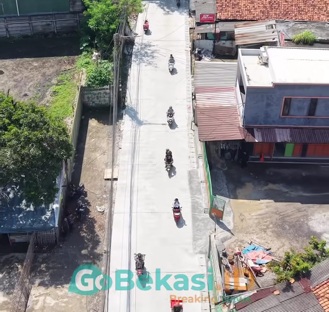 Kota Bekasi - Kondisi ruas Jalan Raya Caringin, Kota Bekasi, yang baru saja dilakukan perbaikan. Foto: Gobekasi.id.