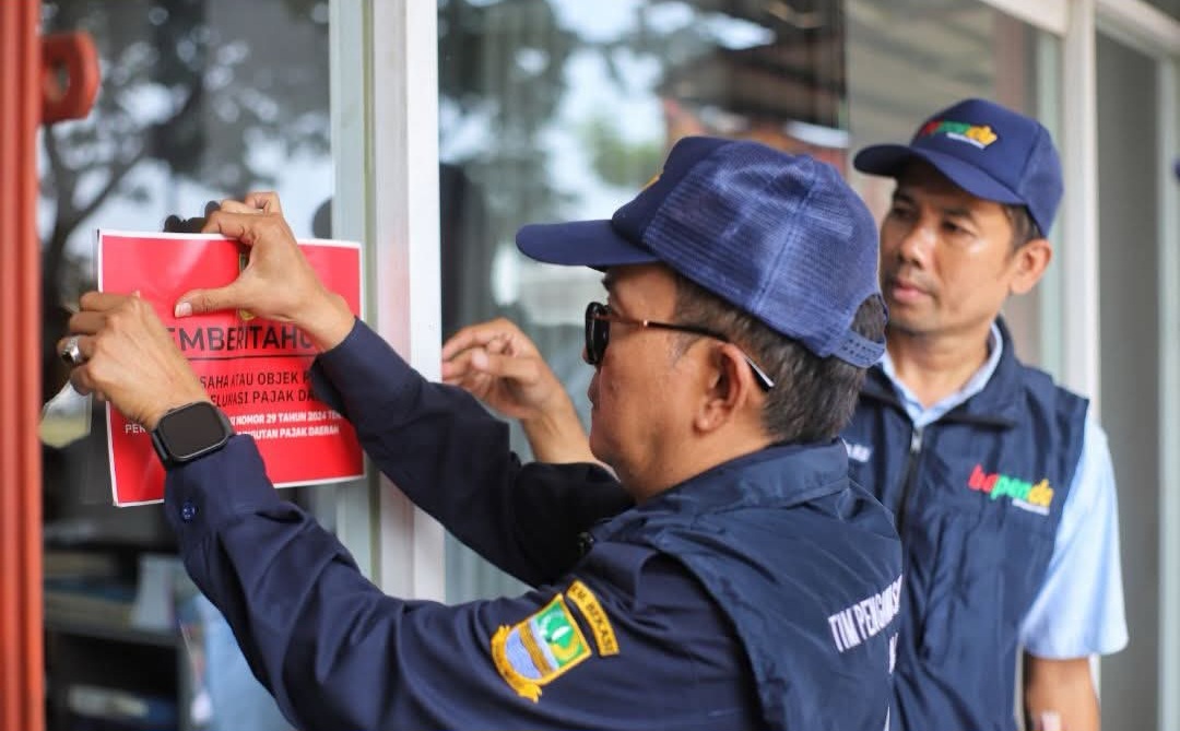 Bekasi - Bapenda Kabupaten Bekasi berupaya menutup kekurangan target PAD 2026 yang masih menyisakan gap Rp 1 triliun melalui optimalisasi pajak dan retribusi daerah. Penindakan terus dilakukan. Foto: Ist